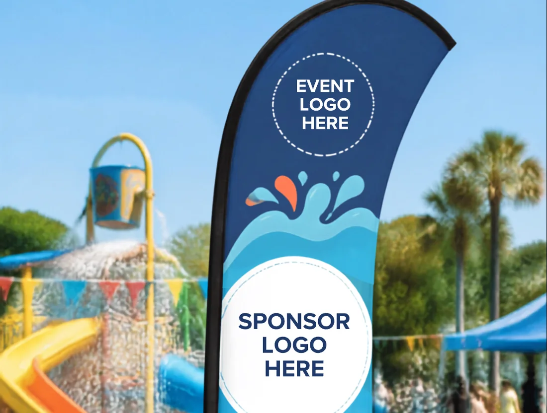 A sponsor banner flag beside a splash park